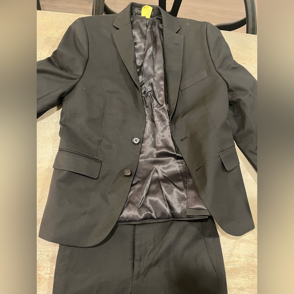 Boys Polo suit in the color black. Size boys 10